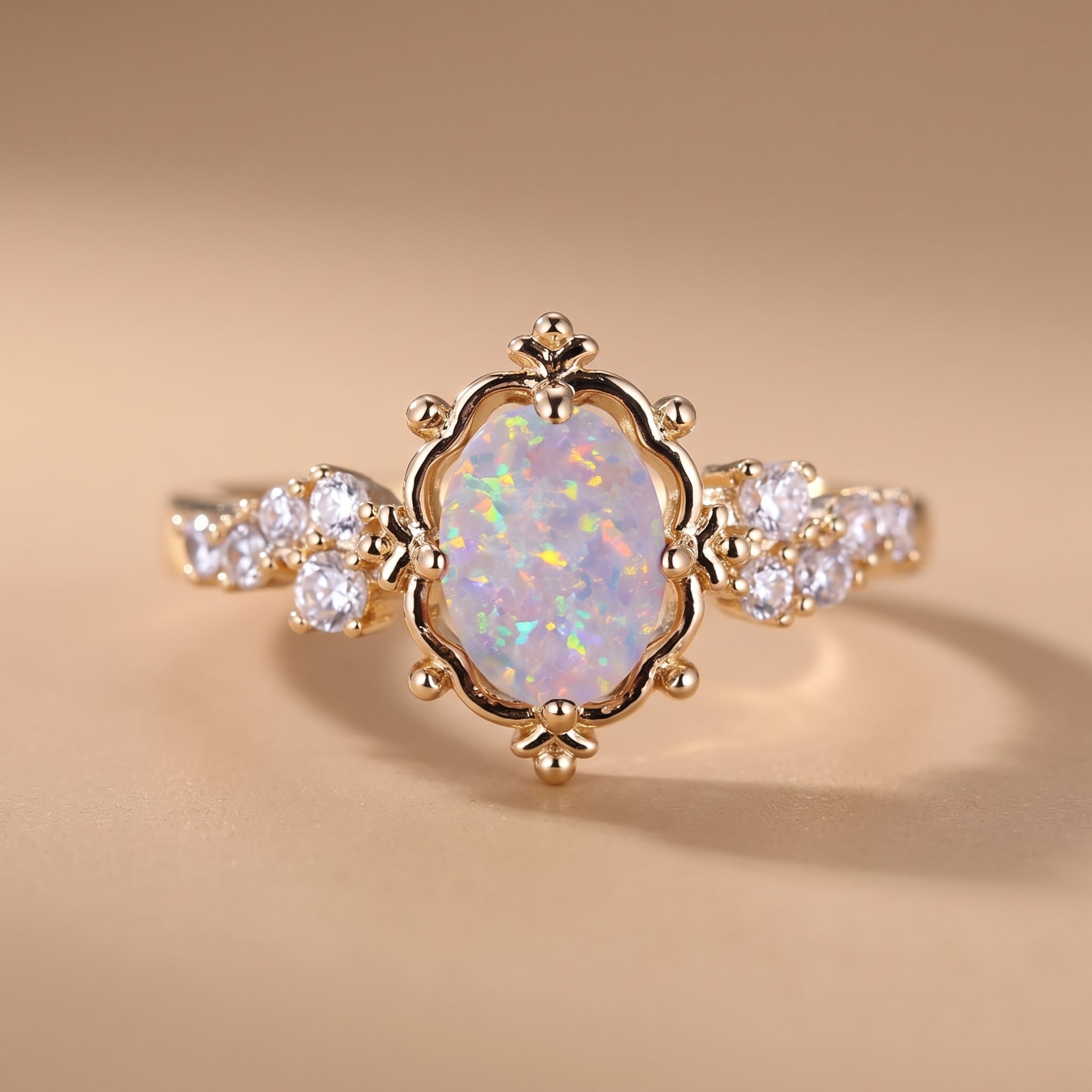 hero: A NEW photorealistic photograph composed from scratch. The product, a ring, rests on a seamless matte warm beige studio surface that flows naturally into a matching softly graduated background. The atmosphere is quiet, neutral, and minimal. The camera is positioned at eye-level, capturing the product in a clean, straight-on view, preserving its natural orientation. A large, soft, diffused light source emanates from camera left, providing gentle frontal fill. This lighting creates controlled highlight…